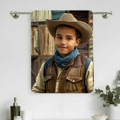 Example of how to upload a boy's photo to create a personalized cowboy portrait on a towel featuring him dressed as a cowboy on a desert ranch