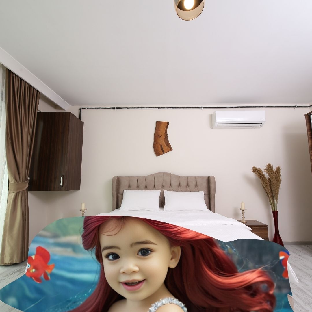 Example of how to upload a toddler girl's photo to create a personalized mermaid portrait on a blanket featuring her as a mermaid sitting on a rock in an underwater scene.