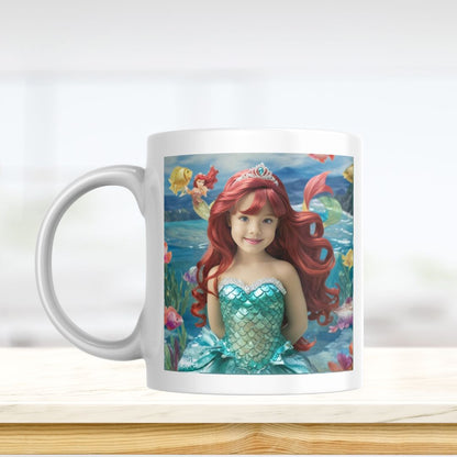 Example of how to upload a girl's photo to create a personalized mermaid portrait on a mug featuring her as a mermaid sitting on a rock in an underwater scene.