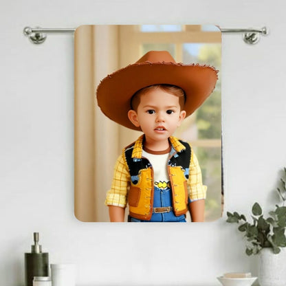 Example of how to upload a toddler boy's photo to create a personalized Woody portrait on a towel, featuring him dressed as Woody, ready for an adventure in the Wild West.